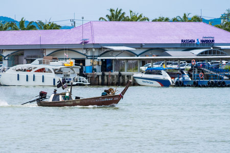Phuket, Thailand - May, 08, 2022 : The fishermen were driving their boats back to the harbor at Phuket, Thailand.のeditorial素材