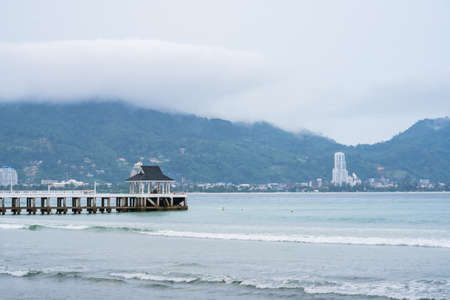 Side view of pier at the beach at morning time.Thailand.の写真素材