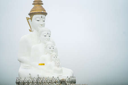 Phetchabun, Thailand - May, 06, 2021 :  White Big Buddha images with different sizes at Wat Pha Sorn...