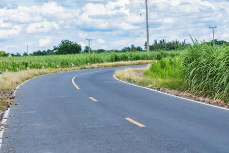 Curve on rural road of thailand.の写真素材