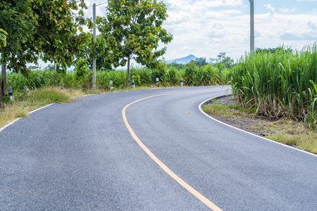 Curve on rural road of thailand.の写真素材