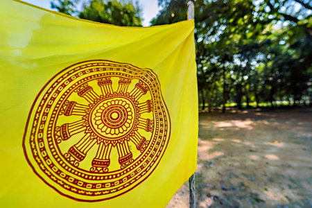 Buddhist flag at a temple of Thailand.の写真素材