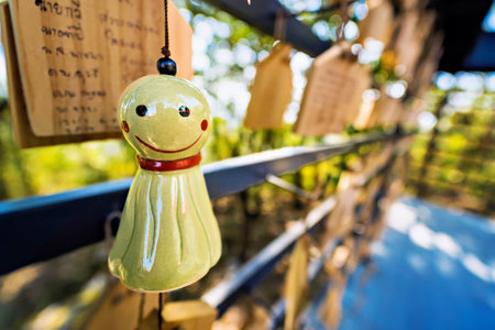 Lampang, Thailand - December, 19, 2022 : Chasing rain Japanese doll hanging in Wat Phra That Doi Phrachanの写真素材