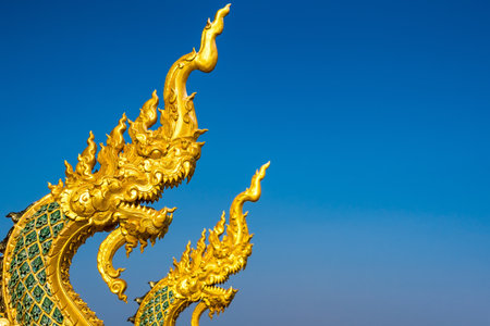 Lampang, Thailand - December, 19, 2022 : Serpent railing with blue sky background at Wat Phra That Doi PhraChan in Lampang, Thailand.のeditorial素材