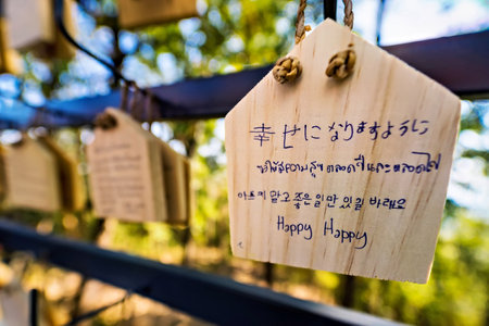 Lampang, Thailand - December, 19, 2022 : Small wooden prayer plaques hanging in Wat Pra That Doi Pra Jhan, Lampang, Thailandの写真素材