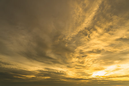 Mesmerizing Golden Hour:Beautiful golden orange evening sky in Thailand.の写真素材