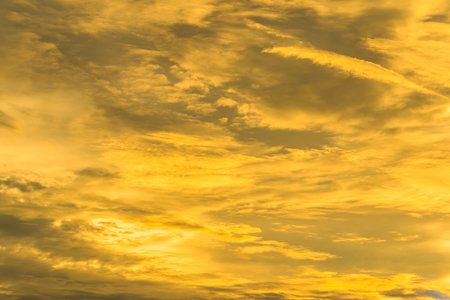 Mesmerizing Golden Hour:Beautiful golden orange evening sky in Thailand.の写真素材