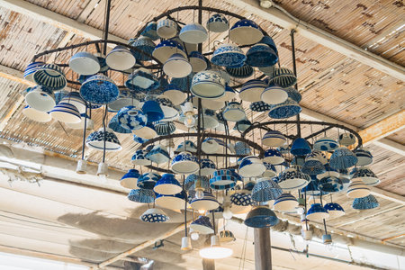Decorate Blune and vintage ceramic plates and bowls hanging on the ceiling.の写真素材