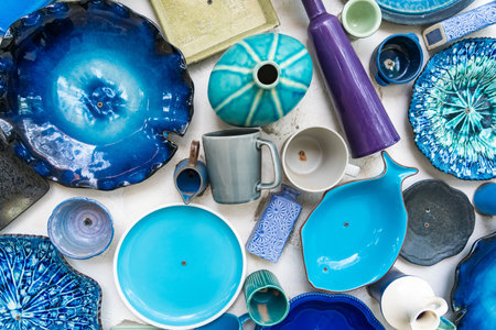 Different colorful ceramic plates on the wall.の写真素材