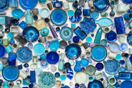 Different colorful ceramic plates on the wall.の写真素材