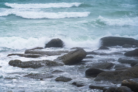 Majestic Evening Seascape: Dramatic Waves Collide with Island Rocks in Eastern Thailanの写真素材