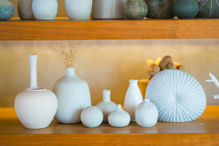 Different ceramic vases on wooden backgroundの写真素材