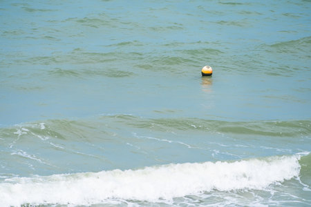 plastic buoy on the sea surface in sunny weatherの写真素材