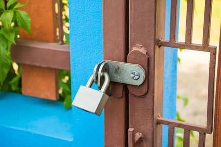 Old lock on the steel door, No entry, close the door.の写真素材