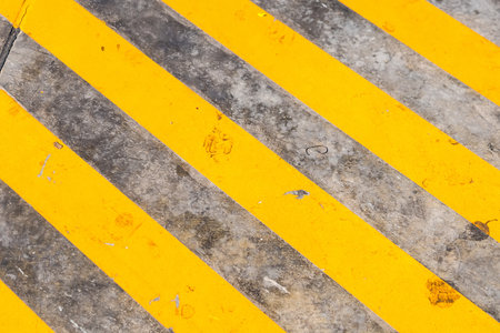 Yellow striped . No parking is allowed on space covered with this stripes, top view backgroundの写真素材