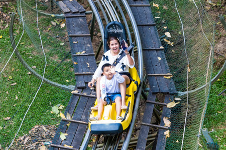 Chiang Mai, Thailand - January,03, 2024: A tourist is playing hill-side roller coaster at Pong Yaeng...