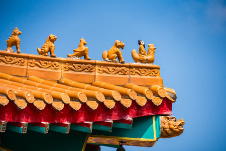 Yellow orange glazed terracotta roof tiles of a Chinese temple.