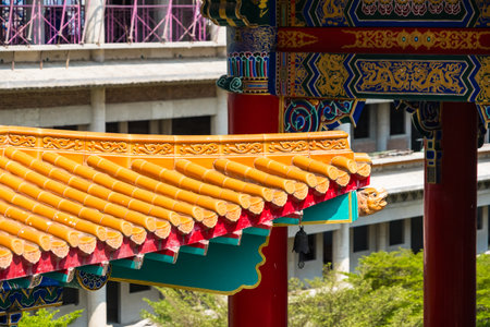 Yellow orange glazed terracotta roof tiles of a Chinese temple.の写真素材