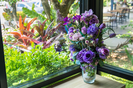 A vibrant bouquet bursting with purple, purple and white blooms, perfect for a romantic wedding or anniversaryの写真素材