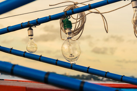 Light Bulb on the roof of a boat with blue sky backgroundの写真素材