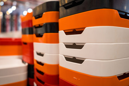 This image showcases an array of vibrant food trays stacked neatly, ideal for catering services,...