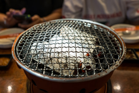A grill with glowing charcoal ready for a BBQ party.の写真素材