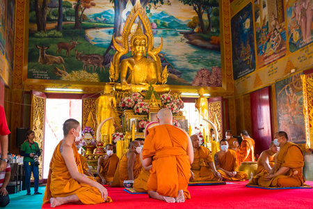 Samut Prakan, Thailand -May, 13, 2024 :A Moment of Reflection: Monks at the Altar at Samut Prakan, Thailand.のeditorial素材