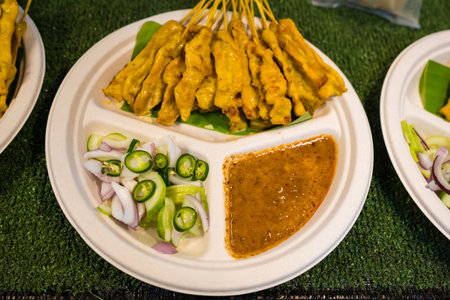 Traditional Thai satay with peanut sauce and fresh toppings.の写真素材