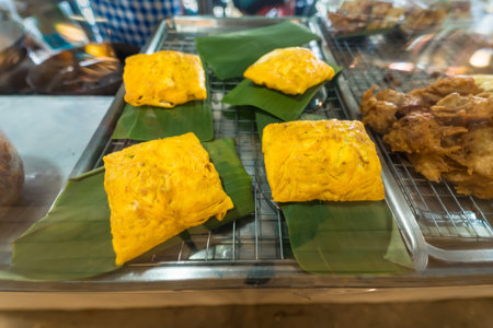 Traditional Thai crispy pancakes filled with delicious savory and sweet fillings, perfect for a traditional street food treatの写真素材