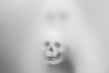 Spooky Ghost in Sunglasses and Skull Amidst Mist â Haunting Art for Halloween and Mysterious Themesの写真素材