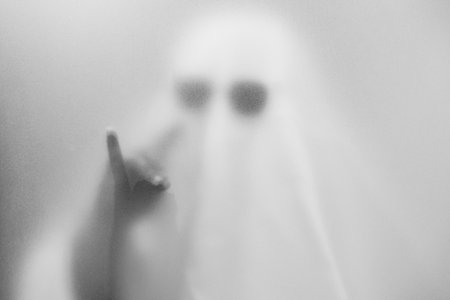 Mysterious Ghostly Figure in Black Sunglasses â Eerie and Minimalistic Halloween Conceptの写真素材