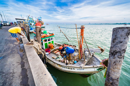 Chonburi, Thailand - November, 18, 2024 : Colorful Fishing Boats Docked at a Bustling Harbor in Thailand, Showcasing Traditional Maritime Culture and Vibrant Coastal Life at Chonburi, Thailand.のeditorial素材