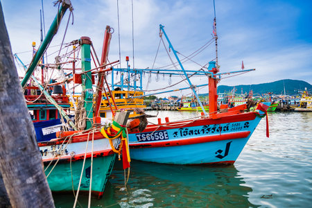 Chonburi, Thailand - November, 18, 2024 : Colorful Fishing Boats Docked at a Bustling Harbor in Thailand, Showcasing Traditional Maritime Culture and Vibrant Coastal Life at Chonburi, Thailand.のeditorial素材