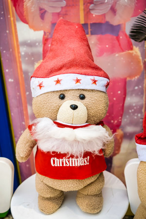 A cute plush teddy bear dressed as Santa Claus, featuring a red hat and white beard, ready to bring joy to your Christmas celebrations.の写真素材