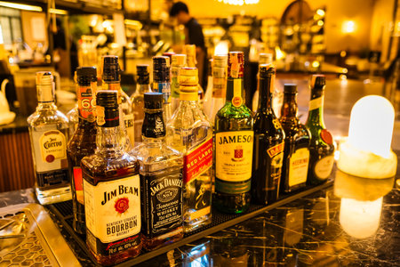 Chonburi, Thailand - November, 18, 2024: A Vibrant Display of Premium Whiskey and Liquor Bottles on...