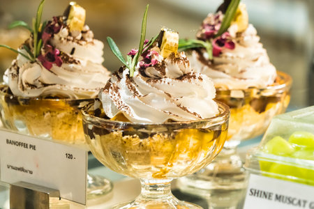 Chonburi, Thailand - November, 18, 2024: Delicious Assortment of Bakery Cakes in a Glass Display Case, Perfectly Arranged for Customers at Chonburi, Thailand.のeditorial素材