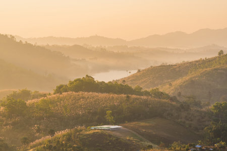 Sunrise Over the Hills: A Beautiful Landscape of Nature's Serenityの写真素材