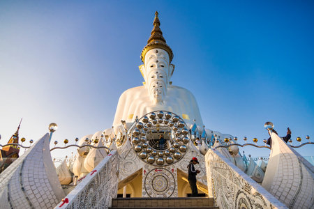 Phetchabun, Thailand - January, 06, 2025 : Majestic White Buddha Statues at Wat Pha Sorn Kaew Temple in Thailand, Surrounded by Beautiful Mountain Scenery and Blue Sky at Phetchabun, Thailand.の写真素材