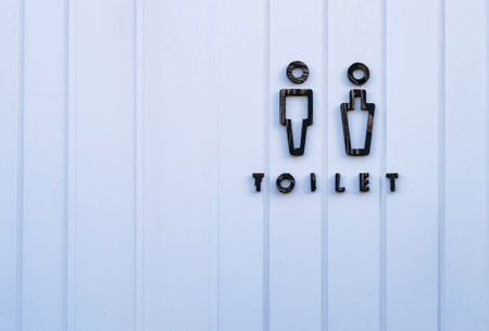Public Restroom Signage - Simple and Clear Icons on White Door