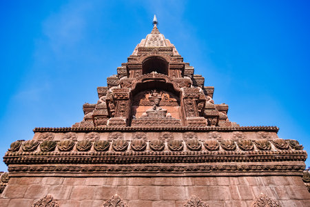 Lop Buri, Thailand - January, 02, 2025 : Ancient stone temple with intricate carvings and steep...
