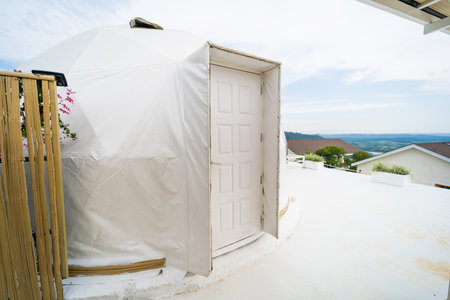 Phetchabun, Thailand - June, 06, 2025 :A modern geodesic dome structure with transparent panels in a...