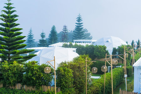 Phetchabun, Thailand - June, 06, 2025 :Scenic view of modern geodesic dome tents in an eco-resort...