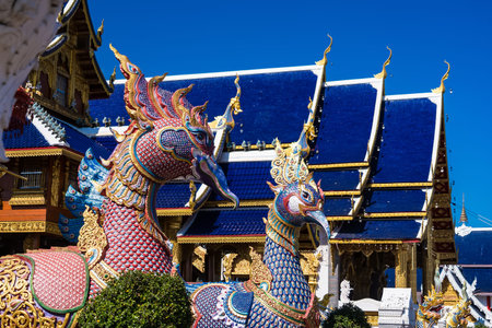 Chiang Mai, Thailand - January, 06, 2026 :Showcasing a vibrant temple with its intricate design against a backdrop of a brilliant sky, embodying the essence of peace and heritage at Chiang Mai Thailand.の写真素材