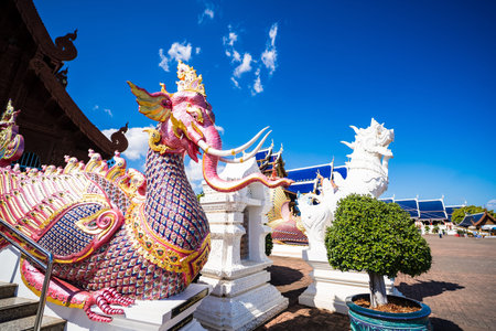 Chiang Mai, Thailand - January, 06, 2026 :Mystical Temple Embellishments: A vibrant depiction of intricate temple architecture, highlighting the beauty of Asian culture with a captivating sky at Chiang Mai Thailand.の写真素材