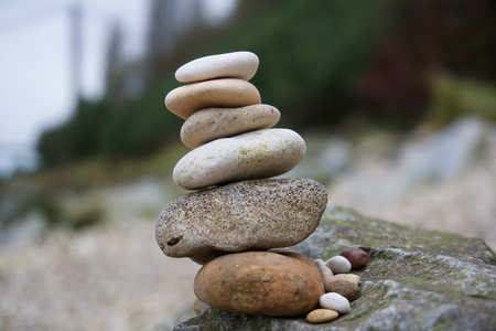 Stacked Stones on a rocky beach by the Humber Bridge, in Hull.の写真素材