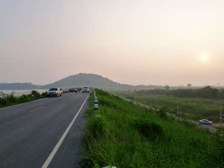 pespective evening on the dam roadの写真素材