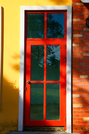 The wood door  with concrete wall,Thailandの写真素材