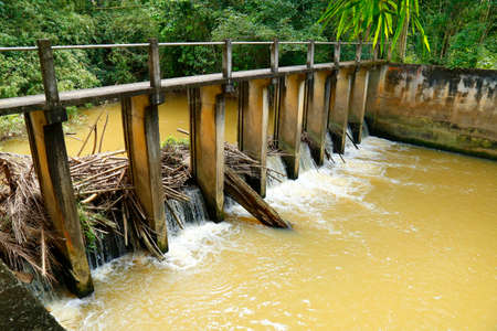 Check dams are small barriers built across the direction of water flow on canal,Thailandの写真素材
