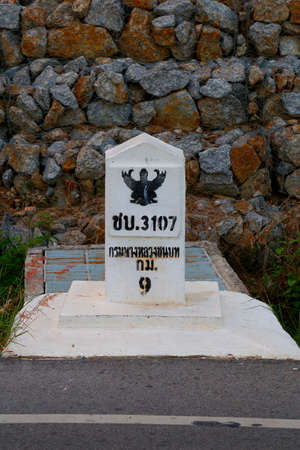 A Kilometer Stone is the solid concrete structure on the road,Thailandの写真素材