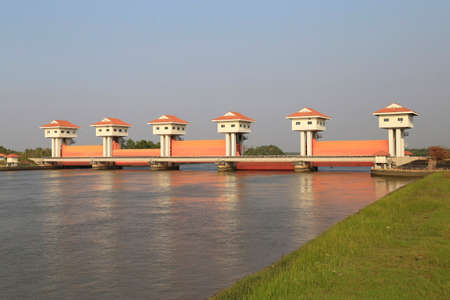 Bang Pakong Dam  are adjustable gates used to control water flow in flood barriers, river, at Chachoengsao  Province, Thailandの写真素材